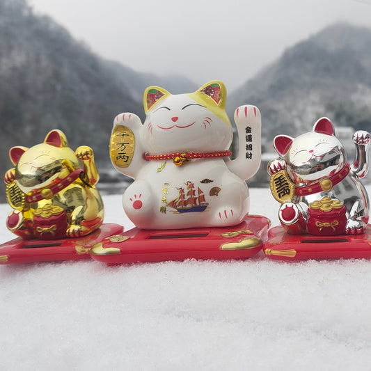 Three little cats with their new friend Yellow ear celebrate Chinese New Year in snowy mountain.