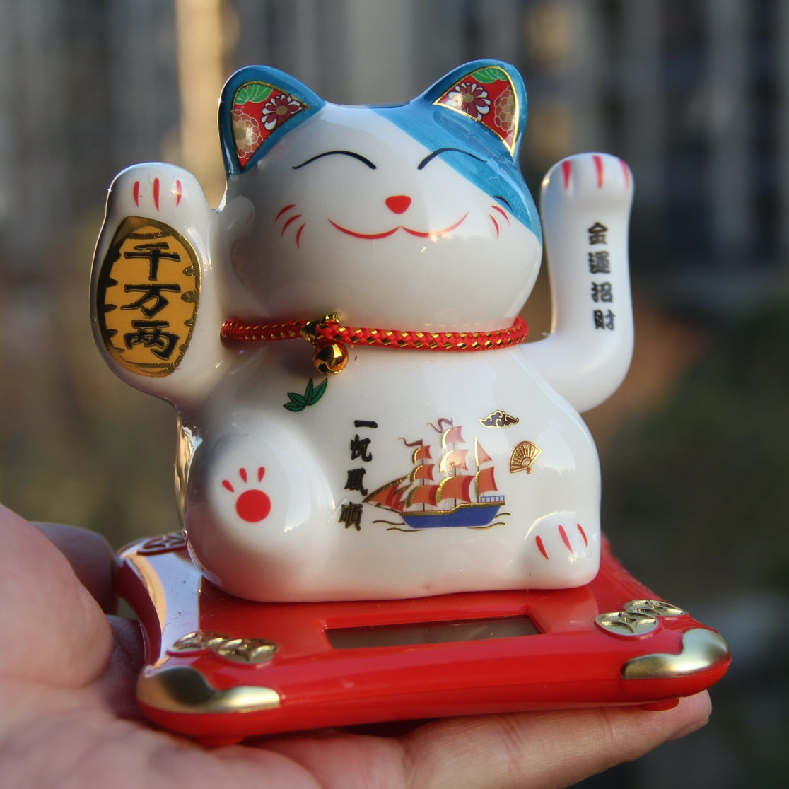 Solar energy auto waving hand Maneki Neko Lucky cat porcelain ceramic.